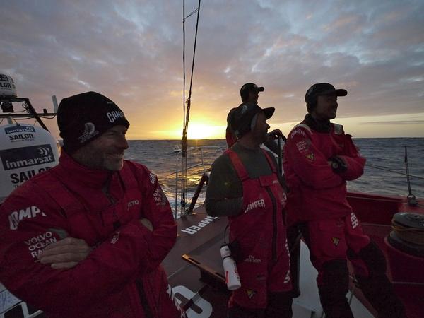 A light hearted sunset gathering on deck on CAMPER.